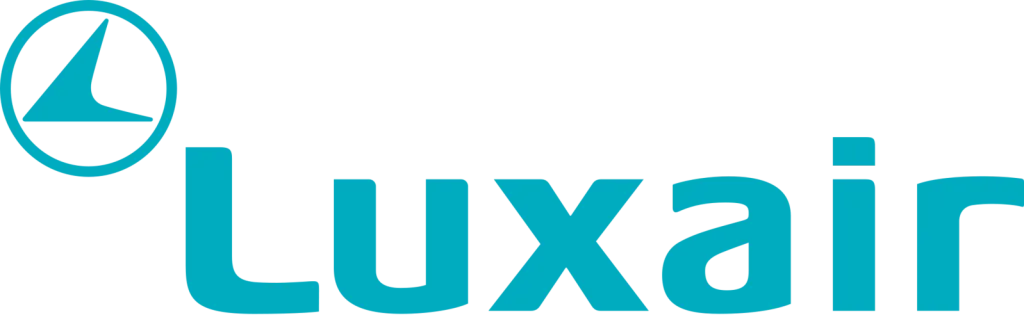 Luxair logo with a stylized bird in a circle to the left of the brand name "Luxair" in light blue lowercase letters, representing quality service including renowned Luxair meals.